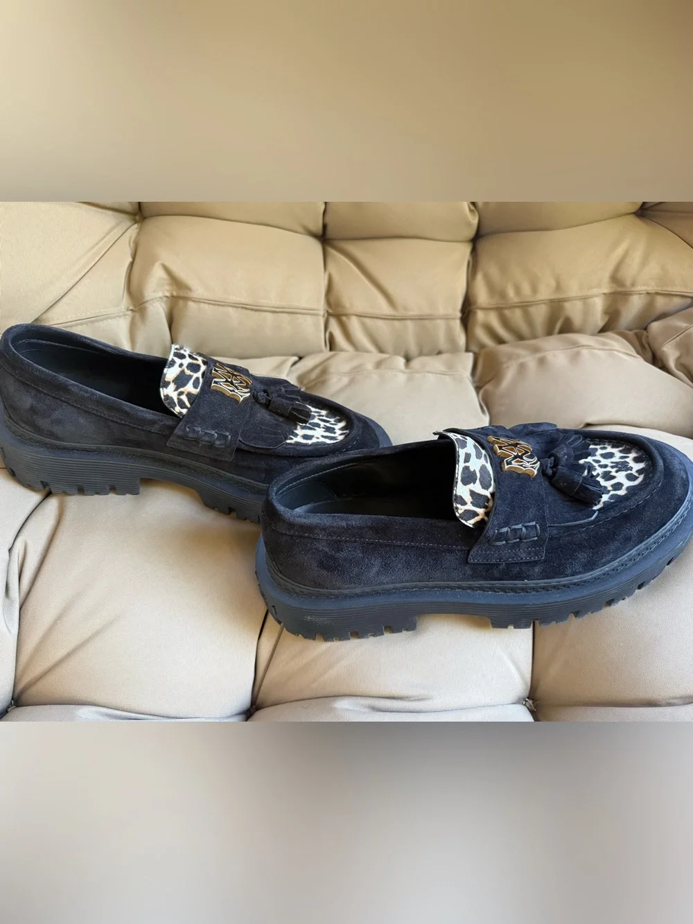 AMIRI Black Suede Tassel Loafers with Leopard Accent and Gold Crest